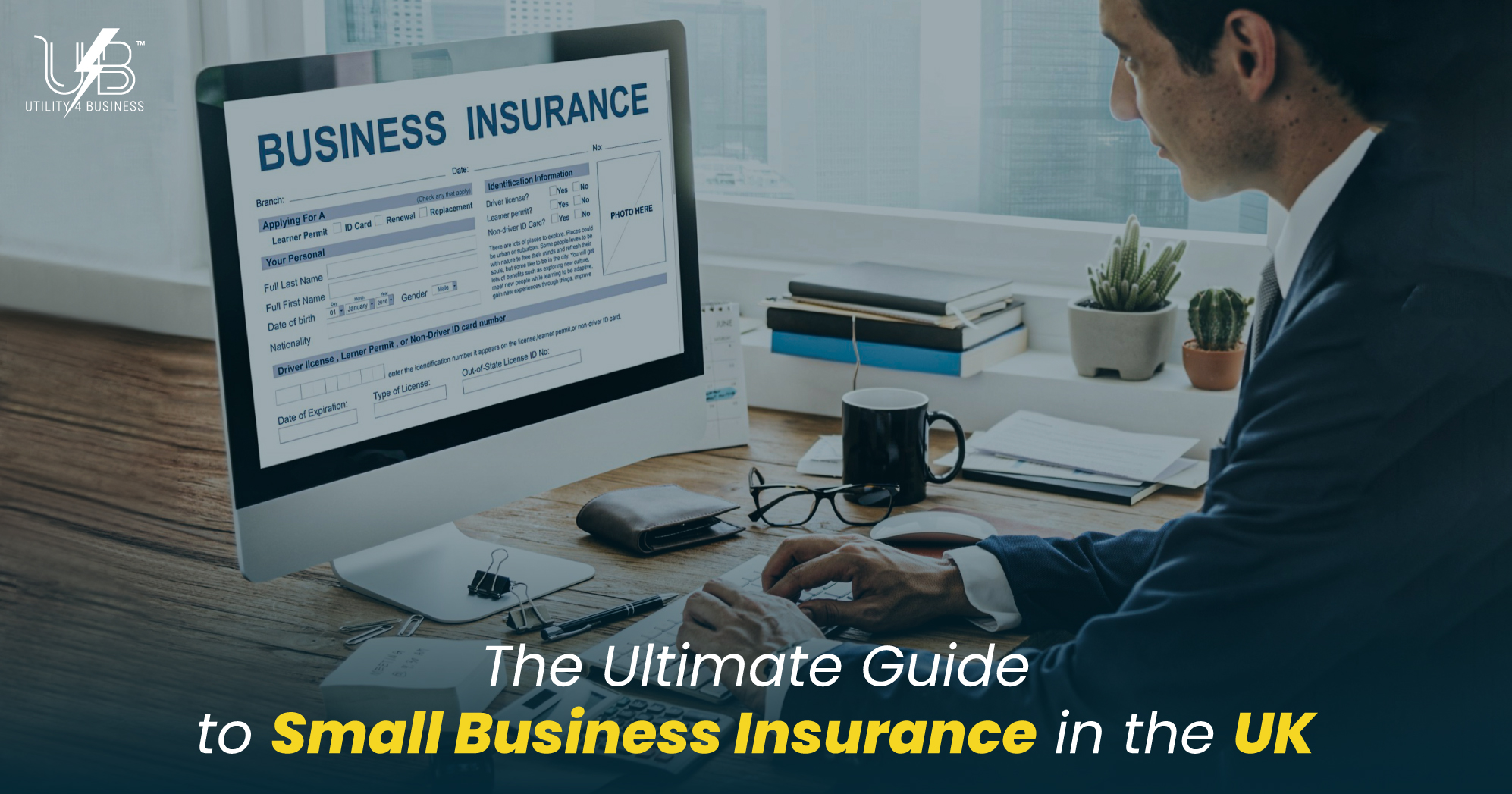 Small business insurance UK guide: professional reviewing business insurance form on computer in modern office.